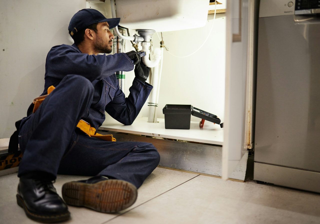 plumbing-handyman-and-maintenance-with-man-in-kitchen-for-repair-industrial-and-inspection-pipes